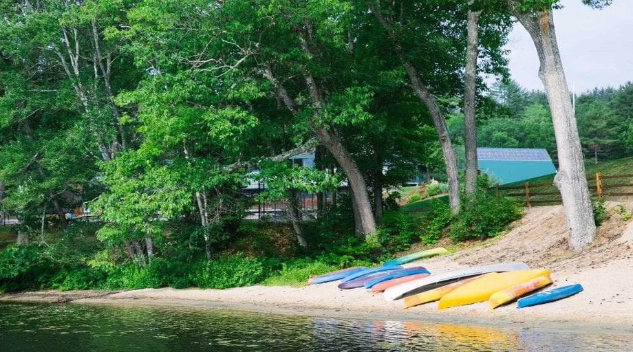 Kayaks and canoes by lake