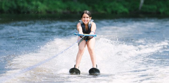 Girl waterskiing on lake